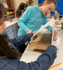 Students collaborate on a Makerspace challenge using at least 3 cardboard connection techniques instead of glue, tape, or other adhesive.